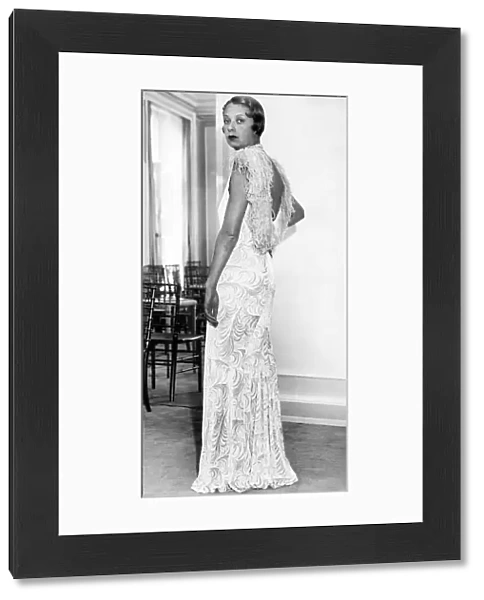 Model wearing embossed velvet evening dress 1932