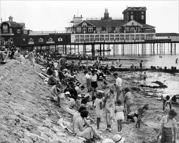 Holidaymakers on the beach by Bognor Regis pier 1935