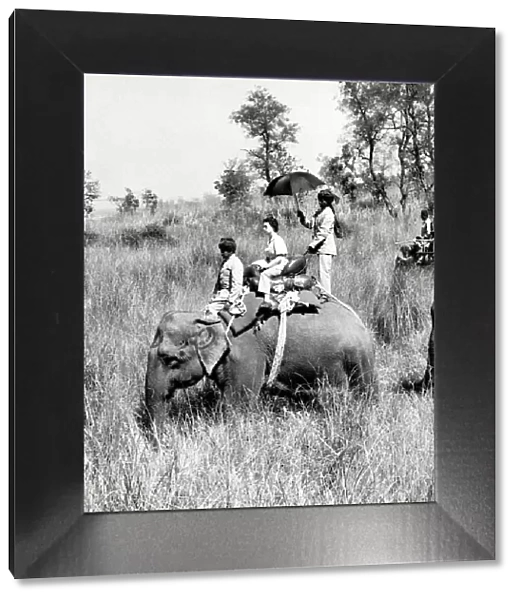 Queen Elizabeth II riding on an elephant in Nepal 1961