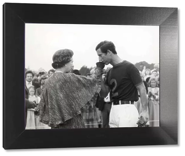 Prince Charles kisses the Queens hand at a polo match 1984