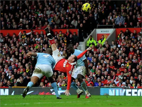Manchester United footballer Wayne Rooney scoring an overhead kick against Manchester City