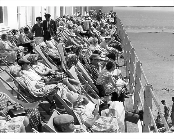 Holidaymakers in deckchairs at Bognor, West Sussex 1960