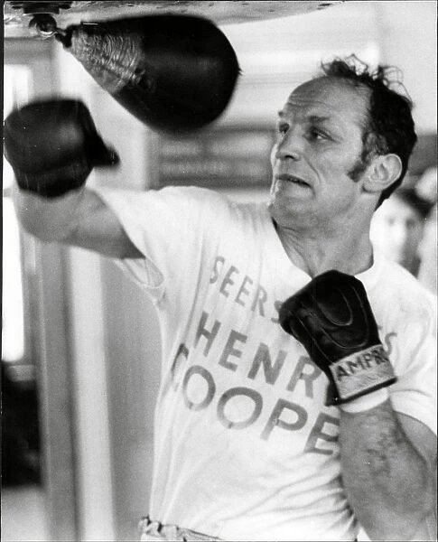 Boxer Henry Cooper in training
