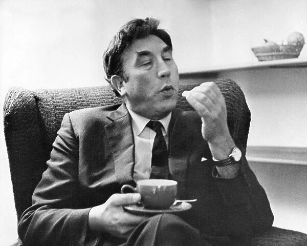 Frankie Howerd, with a cup of tea