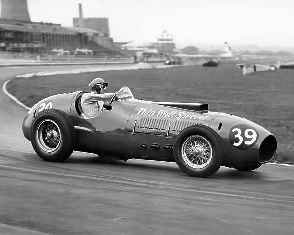 Peter Collins at the wheel of a Ferrari during practice at the Aintree Motor Racing circuit 1958