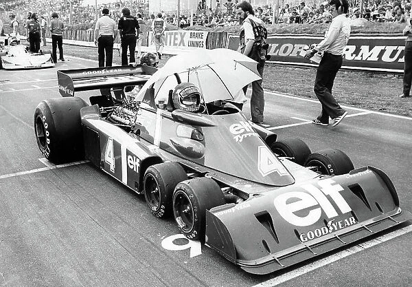 Racing driver Patrick Depailler in his 6 wheel Elf Tyrrell at Brands Hatch for the 1976 Grand Prix