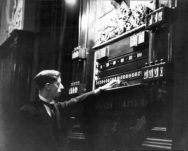 Snooker referee Charlie Chambers, resident at Thurston's for twenty five years, marks the scoreboard