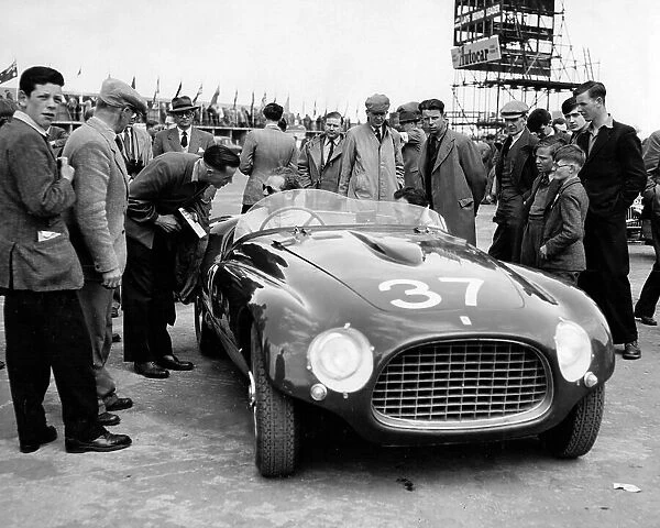 Spectators look at the Ferrari of T.L.H. Cole in the Production Sports Car Race at Silverstone 1953