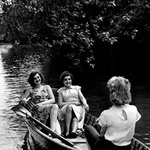 Boating on the lake at Calderstones Park, Liverpool, 1952. The l