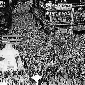 VJ Day celebrations in London, crowds gathered in Piccadilly Circus and Shaftesbury Avenue