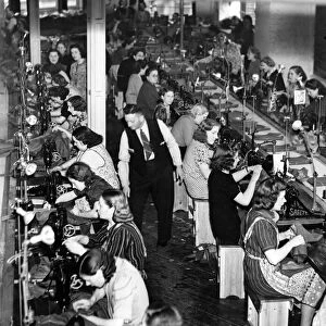 Women sewing army uniforms 1939