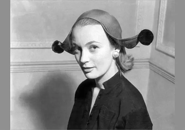 Model wearing jester style hat 1955
