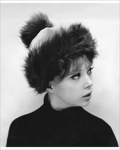 Sixties model Pattie Boyd wearing a pom-pom hat