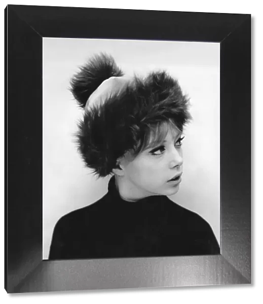 Sixties model Pattie Boyd wearing a pom-pom hat