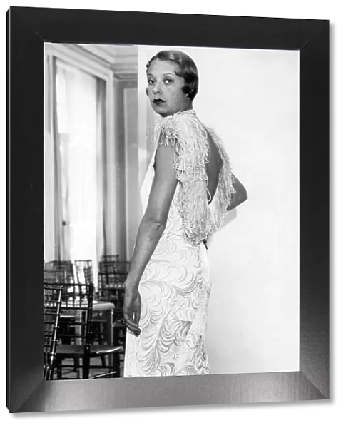 Model wearing embossed velvet evening dress 1932
