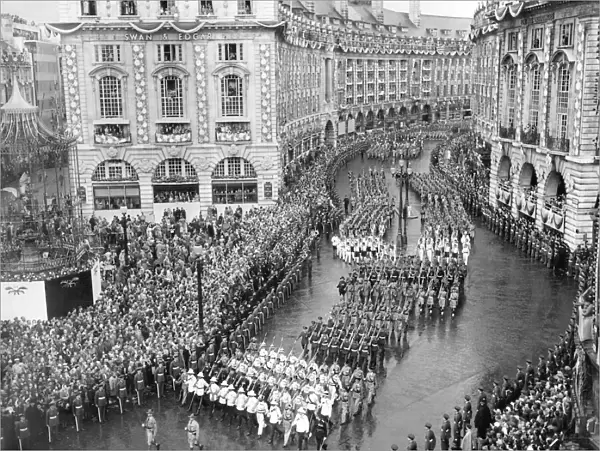 The Coronation procession passes through Piccadilly Circus