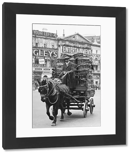 A horse drawn cart in Piccadilly Circus, 1939