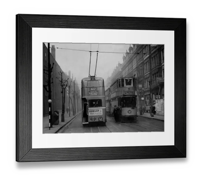 Framed Print : A trolleybus passes a tramcar in Grays Inn Road, London in 1938