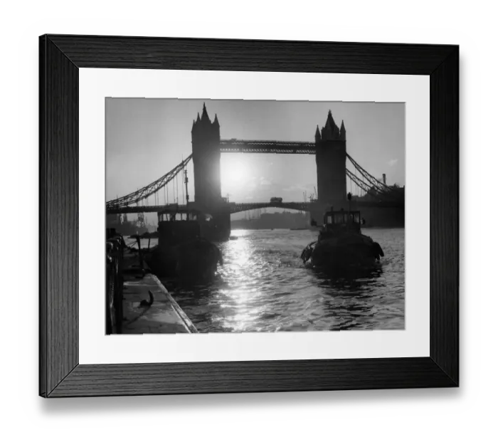 Framed Print : Tower Bridge, London silhouetted with sun behind, 1962 Framed Print : Tower Bridge, London silhouetted with sun behind, 1962