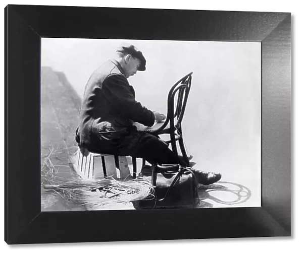 A chair mender in Kensington 1935
