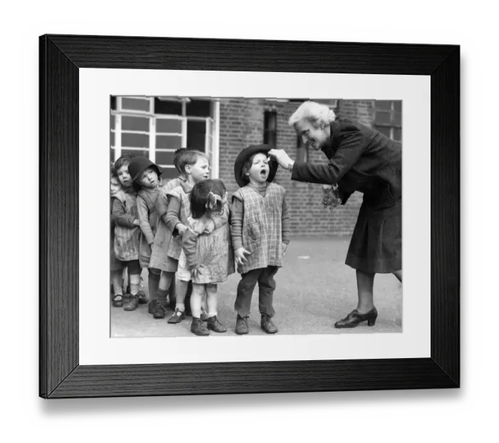 Framed Print : Open wide. Young children at the Greek Road Nursery Day School in Deptford Framed Print : Open wide. Young children at the Greek Road Nursery Day School in Deptford