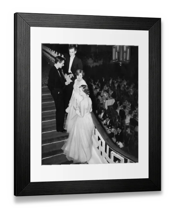 Framed Print : Debutantes and their escorts chat on the stairs at Queen Charlot