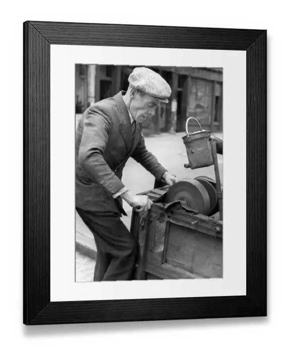 Framed Print : A knife grinder at work, 1946 Framed Print : A knife grinder at work, 1946