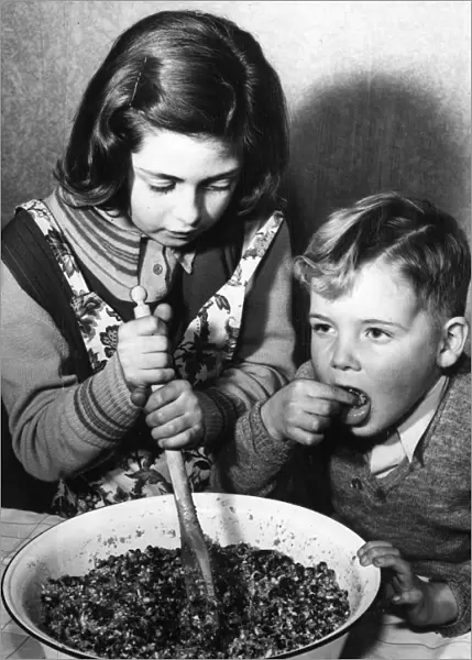 Stirring the pudding, 1952