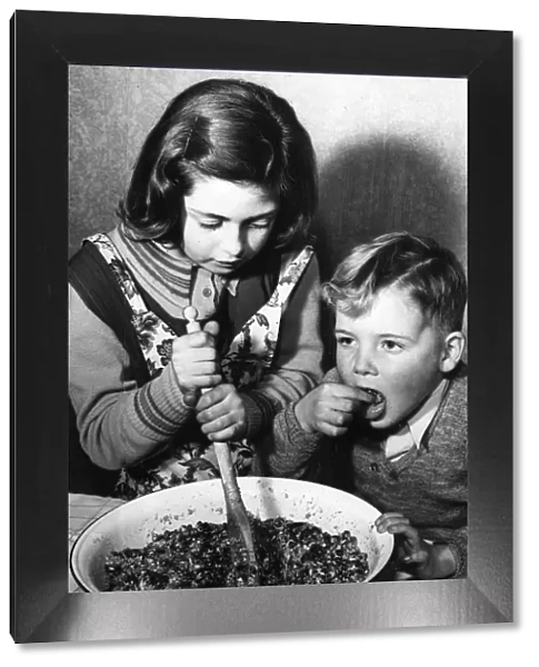 Stirring the pudding, 1952