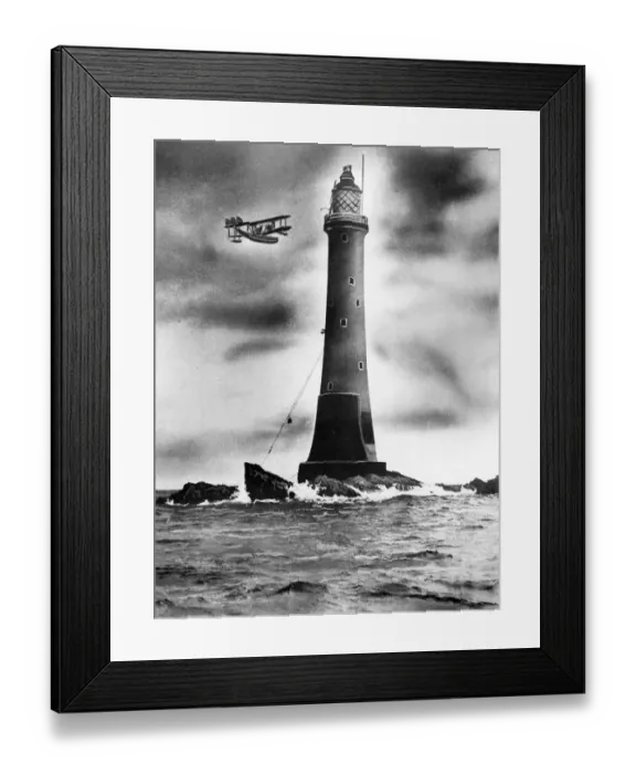 Framed Print : Eddystone lighthouse, with plane flying past Framed Print : Eddystone lighthouse, with plane flying past