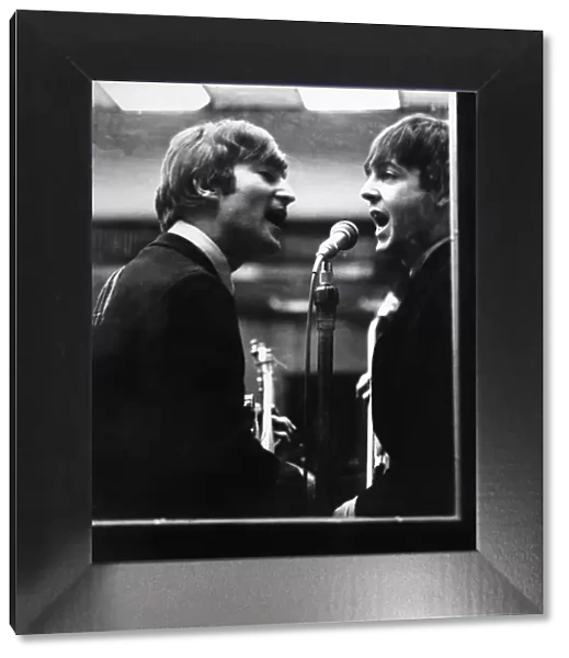 John Lennon and Paul McCartney in a recording studio