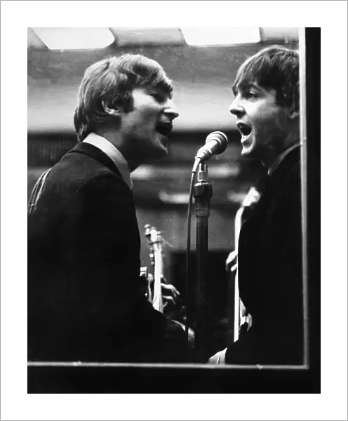 John Lennon and Paul McCartney in a recording studio