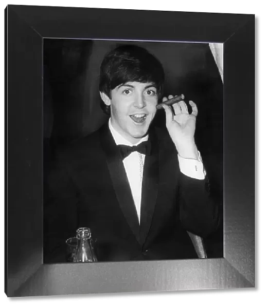 Paul McCartney smokes a havana cigar at The Empire, Leicester Sq
