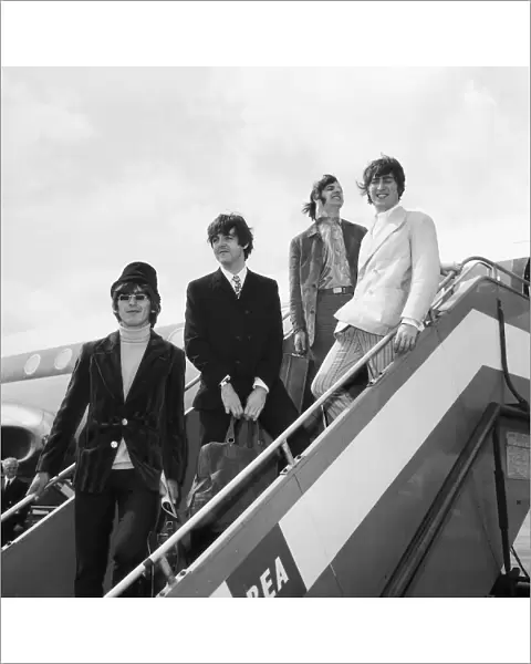 The Beatles at London Airport to fly out to Germany for a brief