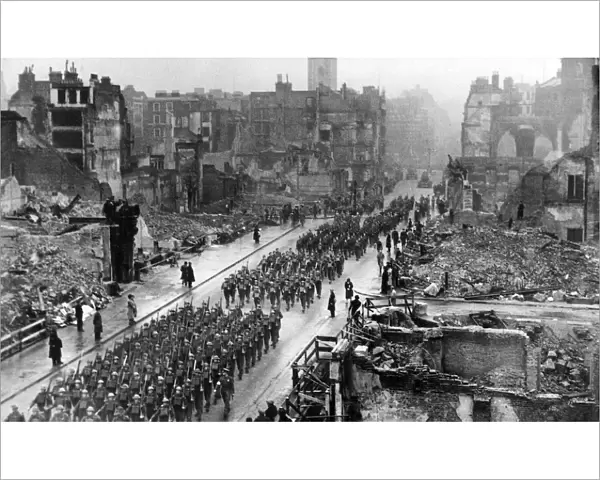 Troops march through London ruins during Remembrance service, 19