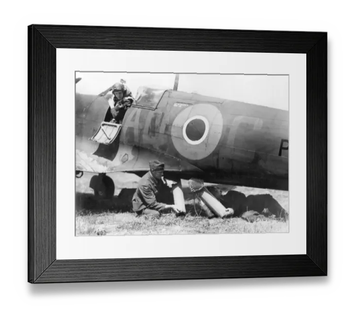 Framed Print : RAF ground crew loading air sea rescue equipment into the belly of a Spitfire