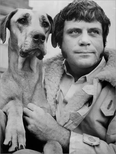Oliver Reed, actor, with Tara the Great Dane he obtained from Ba