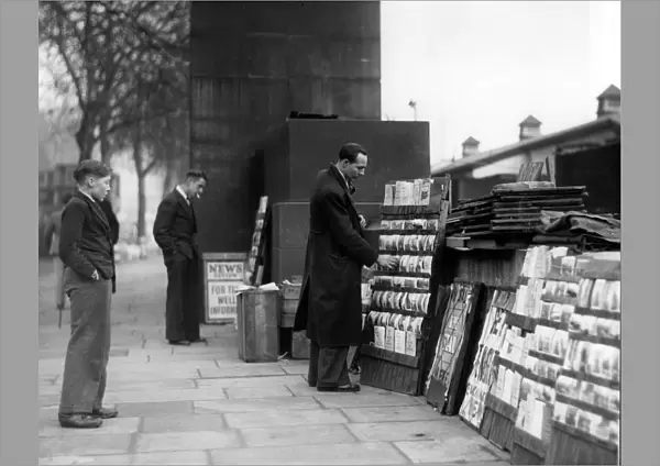 Street trader selling postcards, Embankment, 1946