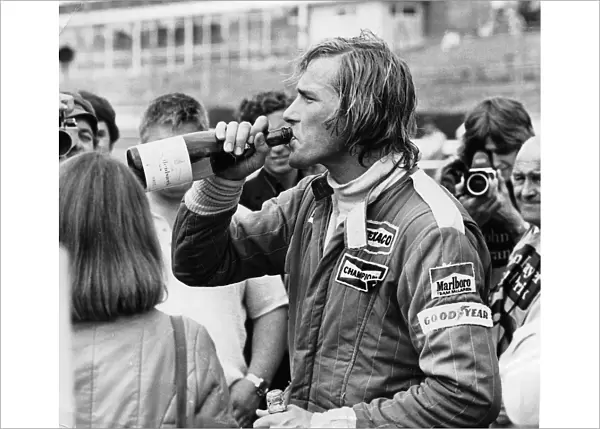 James Hunt swigging champagne