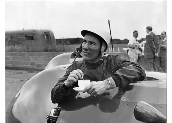 Stirling Moss has a cup of tea