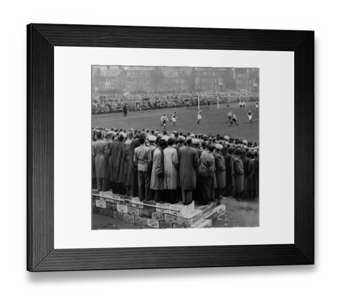 Framed Print : Fans standing on boxes to watch the FA Cup Tie at Great Yarmouth FC football ground 1953 Framed Print : Fans standing on boxes to watch the FA Cup Tie at Great Yarmouth FC football ground 1953