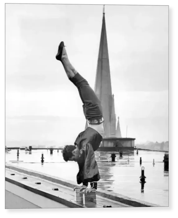 Print : Handstand. Sebastian, a Bertram Mills high-wire act, on the roof of the Royal Garden Hotel Print : Handstand. Sebastian, a Bertram Mills high-wire act, on the roof of the Royal Garden Hotel