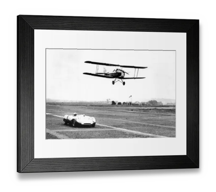 Framed Print : A Tiger Moth aircraft and a Lotus Ford 23B, racing at Usworth Aerodrome 1963 Framed Print : A Tiger Moth aircraft and a Lotus Ford 23B, racing at Usworth Aerodrome 1963
