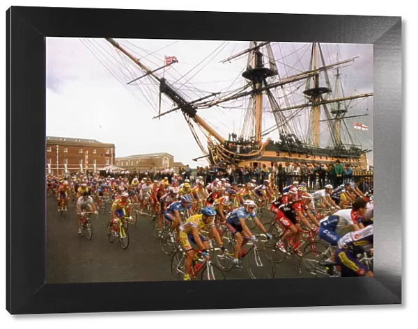 Tour de France cycle race passes through Portsmouth with HMS Victory in background