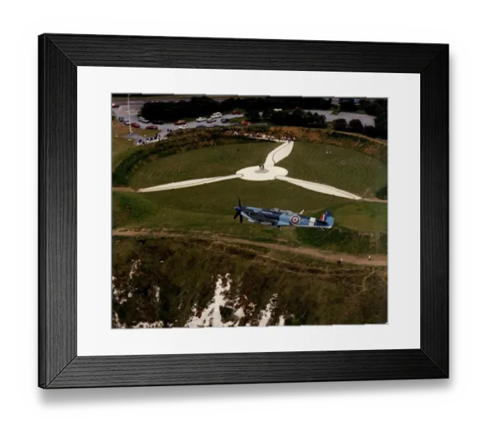 Framed Print : RAF Spitfire flies over the Battle of Britain Museum and Memorial at Capel-Le-Ferne in Dover, Kent