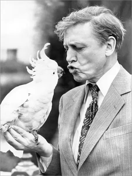Sir David Attenborough with a cockatoo