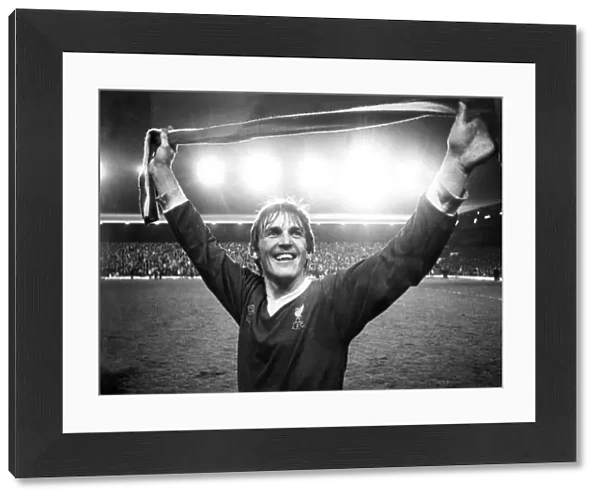 Kenny Dalglish salutes the Kop after Liverpool clinched the league