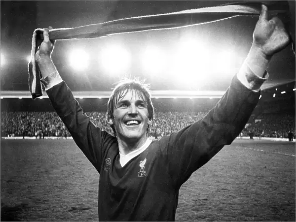 Kenny Dalglish salutes the Kop after Liverpool clinched the league