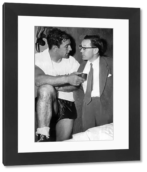Harry Carpenter, journalist, with boxer Rocky Marciano at his training quarters