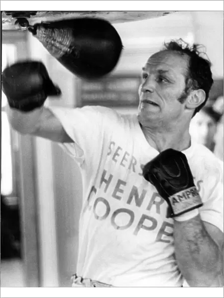 Boxer Henry Cooper in training